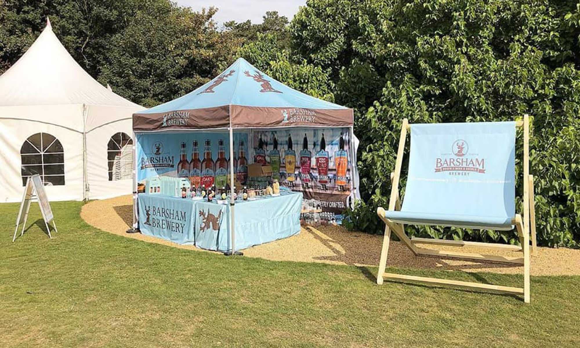 Giant branded deckchair at an outdoor brand activation event
